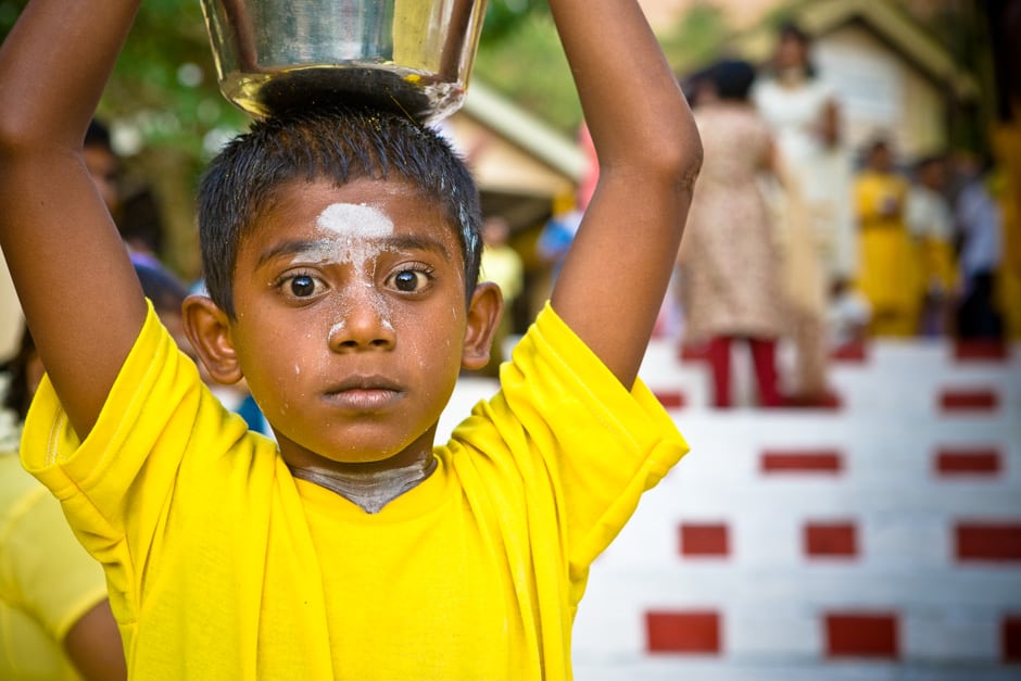 Devotees walk the many steps up to the temple and where they will empty their kavadi of milk over the idol.