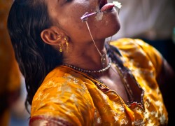 Still under the influence of the spirit she prepares for the next vel through her tongue.