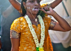 Now she walks with he Kavadi or "burden" of milk to the temple to make an offering.