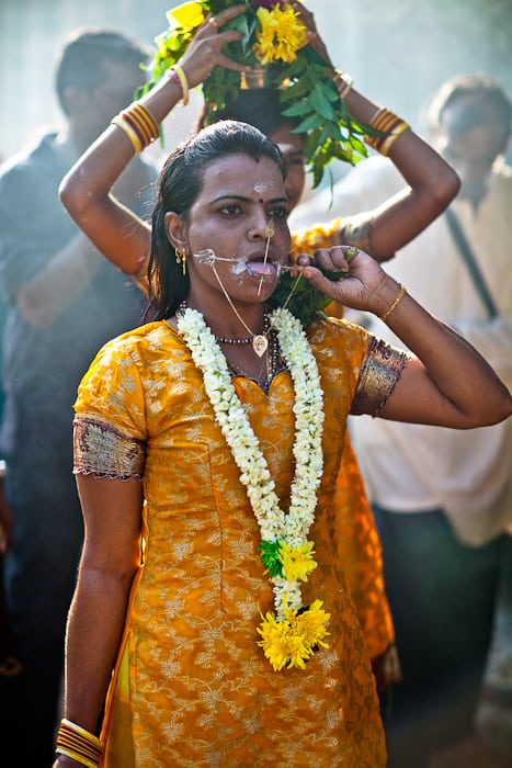 Now she walks with he Kavadi or "burden" of milk to the temple to make an offering.