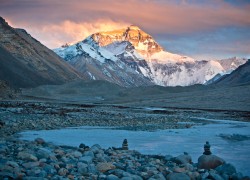 Sunset at Mt. Everest with Chorten stones (similar to cairn stones) in the foreground.